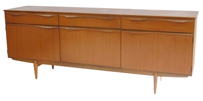 Lot 798 - A teak sideboard, with an arrangement of three...
