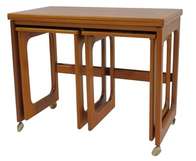 Lot 823 - A G-Plan style nest of tables, the largest...