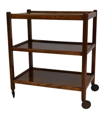 Lot 825 - An oak three tier trolley, with castors, 66cm...