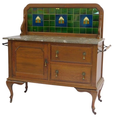 Lot 827 - An early 20thC oak washstand, the raised back...