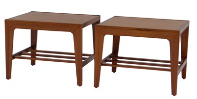 Lot 839 - A pair of teak side low tables, each with a...