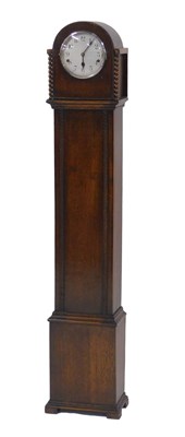 Lot 852 - A 1920s oak grandmother clock, with silvered...