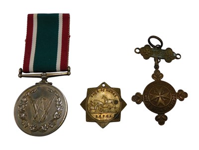 Lot 324 - A Women's Voluntary Society Service medal, for...