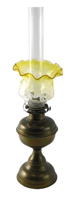 Lot 124 - A brass oil lamp, with yellow tinted...