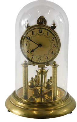 Lot 132 - A German brass anniversary clock, with glass...