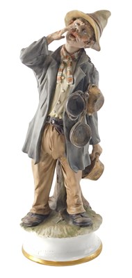 Lot 135 - A Capodimonte porcelain figure of a man...