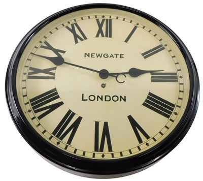 Lot 130 - A black metal factory type clock, the dial...