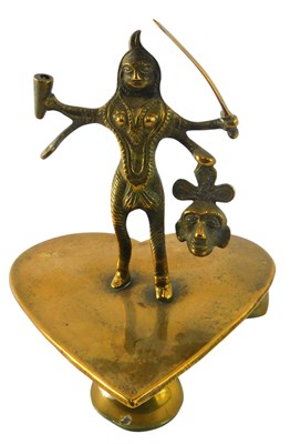Lot 141 - An Indian brass figure of Kali, on a heart...