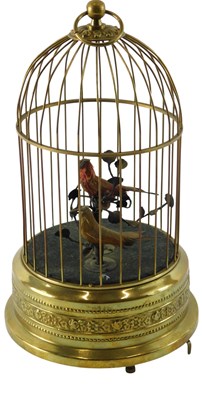 Lot 193 - A Polish brass musical bird cage, with two...