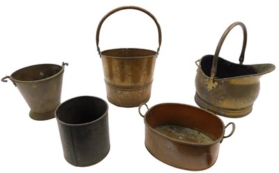 Lot 222 - A copper and brass helmet shaped coal...