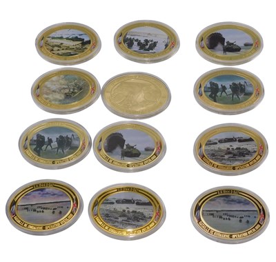 Lot 380 - A set of twelve oval gold plated copper...