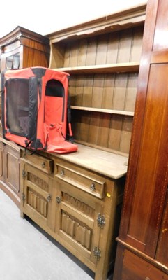 Lot 1507 - An oak kitchen dresser, with brass effect drop...
