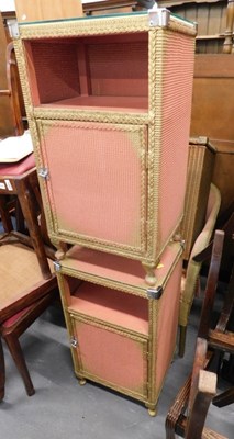 Lot 1517 - A pair of Lloyd Loom bedroom cabinets, pink...