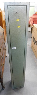 Lot 1534 - A green painted steel lockable gun cabinet,...