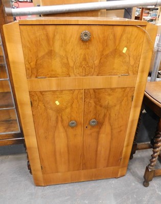 Lot 1502 - A mid-century walnut veneer drinks cabinet,...
