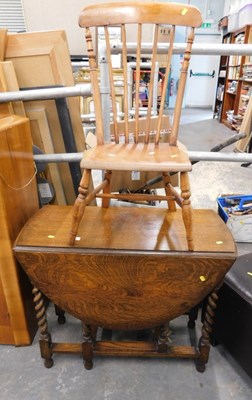 Lot 1503 - An oak drop leaf table, on barley twist legs,...