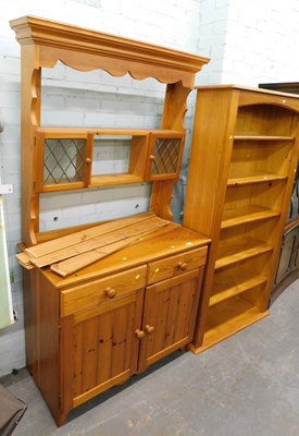 Lot 1505 - A pine display cabinet with two drawers over...