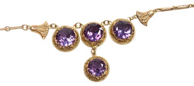 Lot 303 - An Egyptian rose gold and imitation...