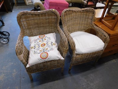 Lot 1552 - A pair of woven cane conservatory armchairs.