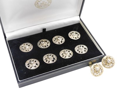 Lot 311 - A set of eight dress buttons and a pair of...