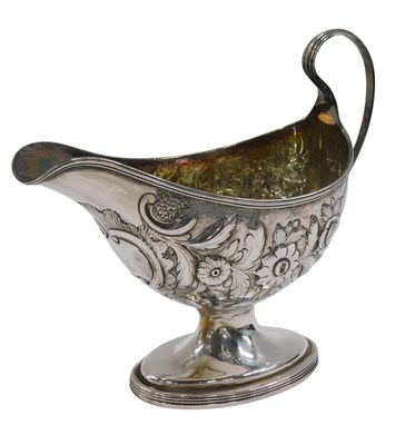 Lot 511 - A 19thC silver sauce boat, later embossed with...