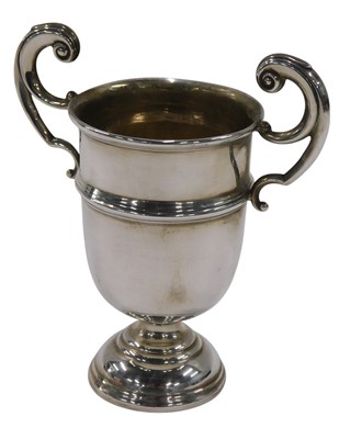 Lot 513 - An Edwardian silver two handled cup, on a...