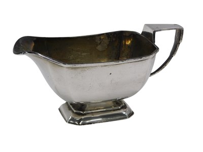 Lot 514 - A George V Art Deco silver milk jug, of...