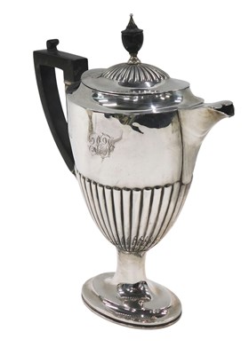 Lot 519 - An Edwardian silver part fluted coffee pot,...