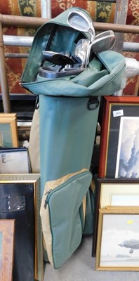 Lot 1571 - A golf club bag, containing golf clubs,...