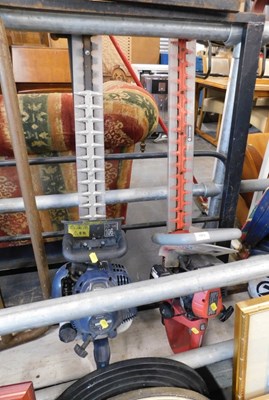 Lot 1573 - A Sovereign SHT3400 petrol hedge trimmer,...