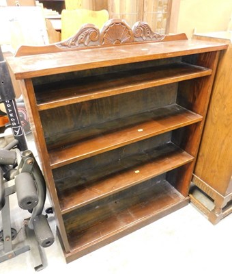 Lot 1598 - A mid-century oak open bookcase, with carved...
