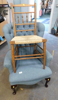 Lot 1601 - A blue upholstered button back chair, on...