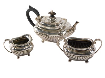 Lot 297 - An early 20thC silver plated three piece tea...