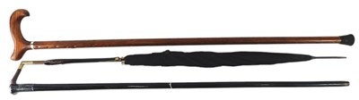Lot 539 - A Victorian ebonised walking cane, with silver...