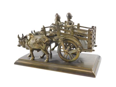 Lot 554 - An Indian brass model of a cart being pulled...