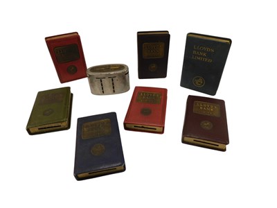 Lot 556 - Various Lloyds bank book shaped money boxes.