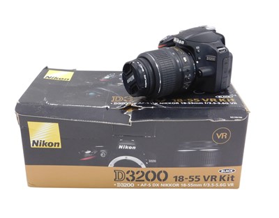 Lot 579 - A Nikon D3200 camera, with lens, box and some...