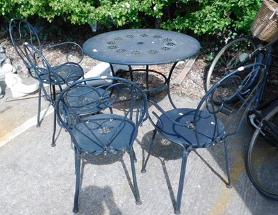 Lot 1653 - A black painted metal garden table and four...