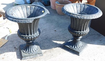 Lot 1663 - A pair of painted cast metal planters.