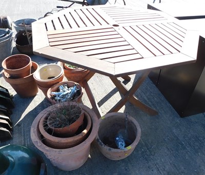 Lot 1665 - A quantity of terracotta plant pots, and an...