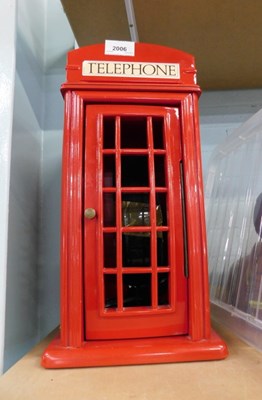 Lot 2006 - A novelty telephone, in a replica red...