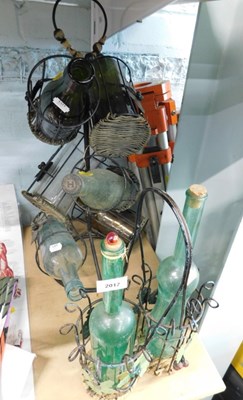 Lot 2017 - Two decorative metal bottle racks, containing...