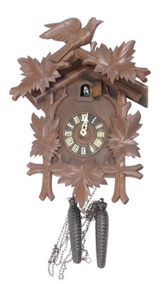 Lot 779 - A Black Forest cuckoo clock, the case carved...