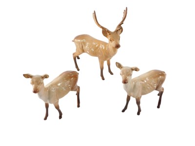 Lot 844 - A Beswick stag and two deer, the stag 20cm high.