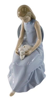 Lot 855 - A Nao porcelain figure of a seated lady with a...