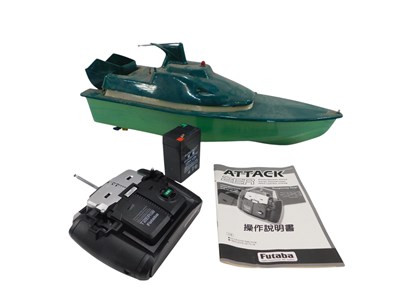 Lot 910 - A green painted remote control boat, with...