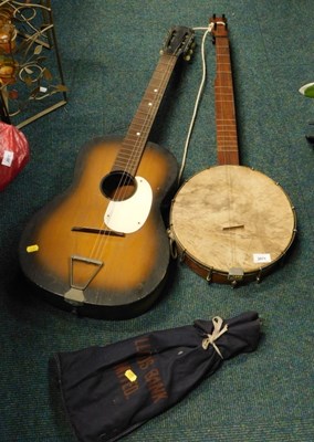 Lot 2071 - A four string banjo, an acoustic guitar, and a...