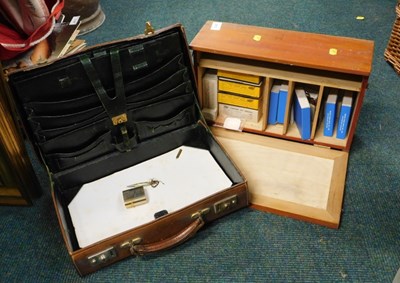 Lot 2075 - A small tan briefcase, and a Boots drug...