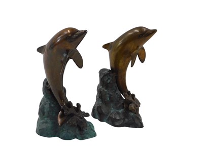 Lot 958 - A pair of bronze model figures of dolphins,...