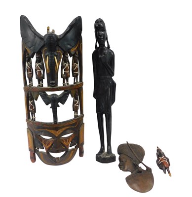 Lot 961 - Tribal Art. A carved mask with bone inlay,...